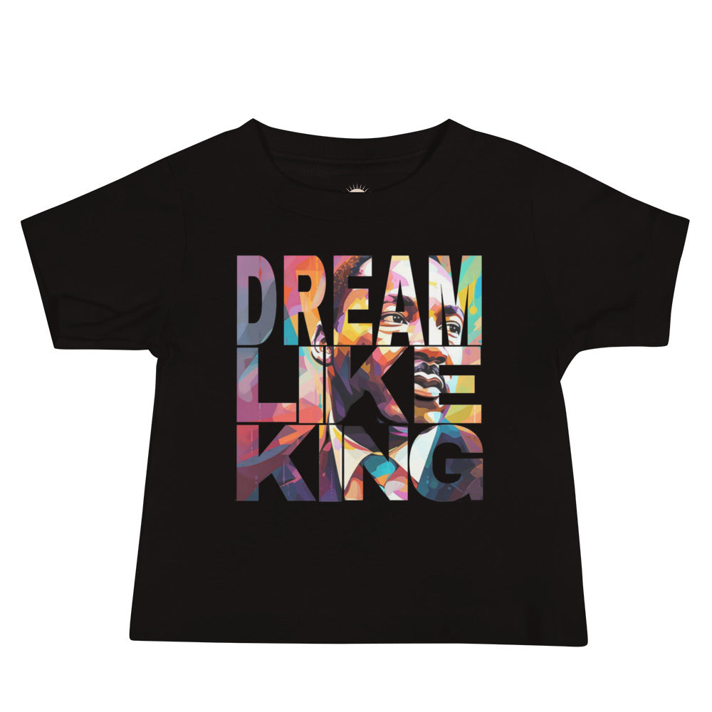 Black baby t-shirt with “Dream Like King” design celebrating heritage, confidence, and empowerment.
