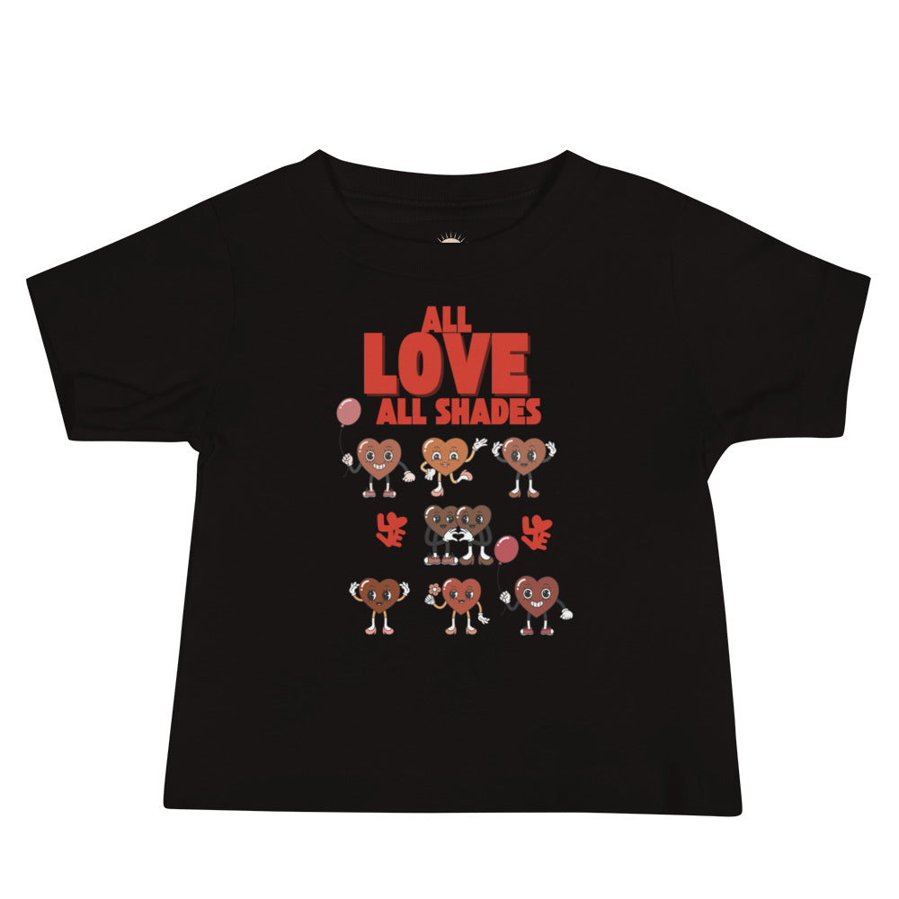 Black baby t-shirt with hearts in shades of brown with red caption “All Love, All Shades,” celebrating diversity and unity.