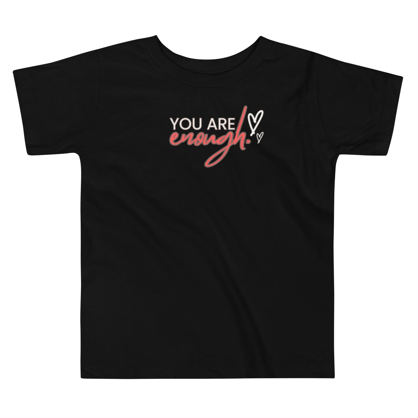 Black toddler t-shirt with cream “You Are,” bold red “Enough,” and two cream hearts, designed to inspire self-worth.