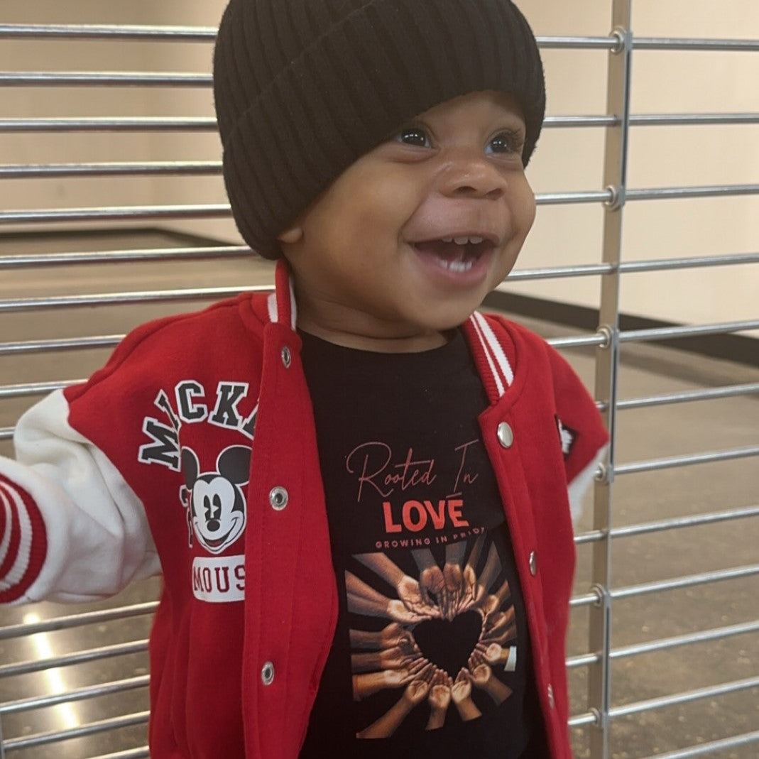 baby boy wearing Rooted in Love kids’ empowerment t-shirt celebrating Black heritage, pride, and confidence.