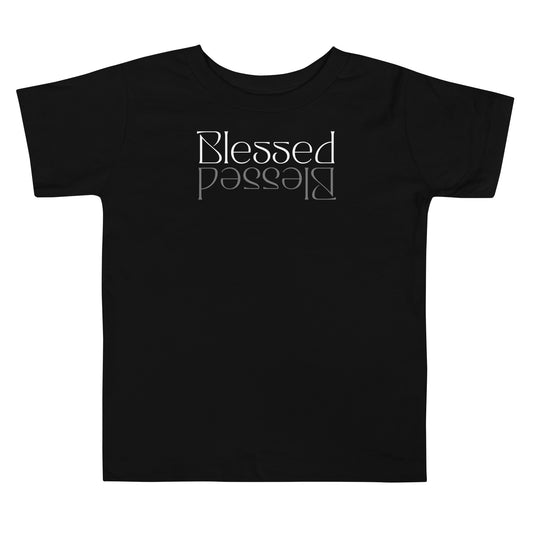 Toddler t-shirt with “Blessed” in white mirrored in gray, promoting faith, gratitude, and confidence.